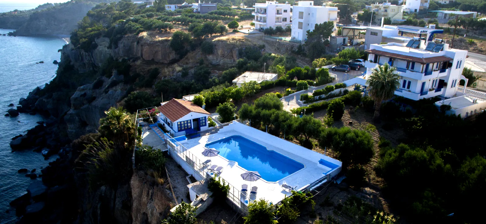 Aerial view of Creta Sky on the cliffs of Achlia, the pool set above the sea